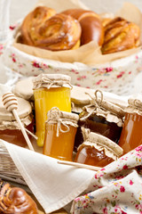 Honey in jars and rolls.