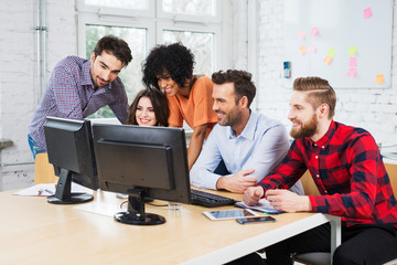 Group of business people working together in office on desktop c