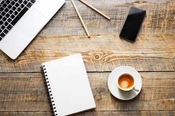 Working place with laptop on wooden table