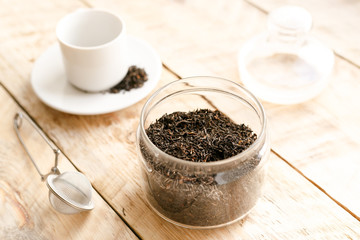 Tea set on the wooden table at sunny morning