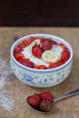 milk rice porridge with fruit strawberry and banana breakfast snack