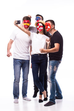 Group of football fans their national team: Spain, Czech Republic, Turkey, Croatia take selfie photo on white background. European football fans concept.