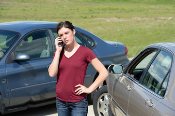 Woman Using Cellphone After Accident