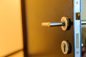 Modren style door handle on natural wooden door