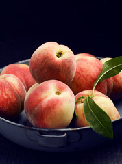 Peaches over wooden background