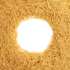 Round frame made of dry noodles pasta over isolated white background