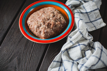 minced meat on wooden table