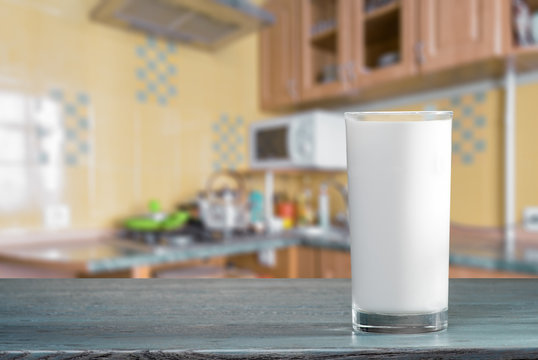 Glass of milk on the kitchen table