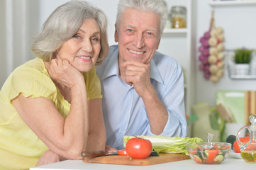 senior man and woman  in the kitchen
