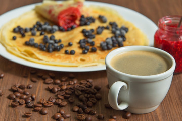 pancakes with blueberries and jam and coffee
