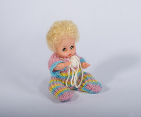 Fototapeta premium Doll in knitted clothes