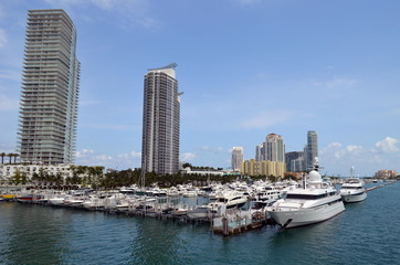 Fototapeta na wymiar Luxury Condominium Towers overlooking a marina in miami beach,florida