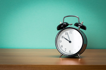 Retro alarm clock on a table.