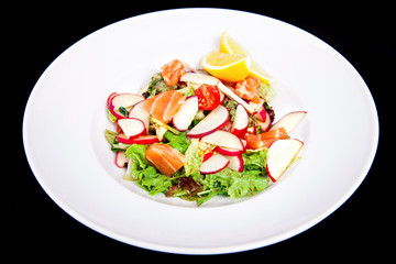 Healthy salad with vegetables and salmon