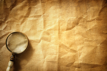 Vintage background with magnifying glass