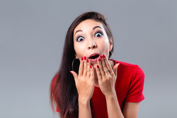 Brunette in Studio very surprised with hands to face