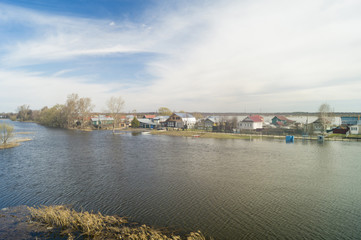 Fototapeta na wymiar Spring landscape with river in rural terrain