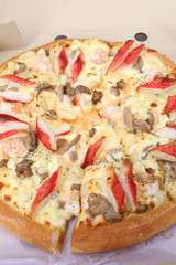 traditional of hot cheese pizza on paper box.