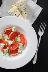 Grapefruit with blue cheese and rosemary