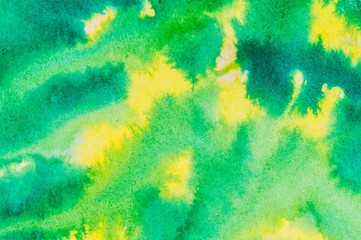 Fototapeta na wymiar Yellow and green colored ink wash background.