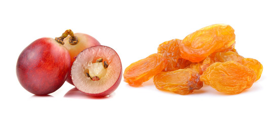  grape and Dried raisins on a white background