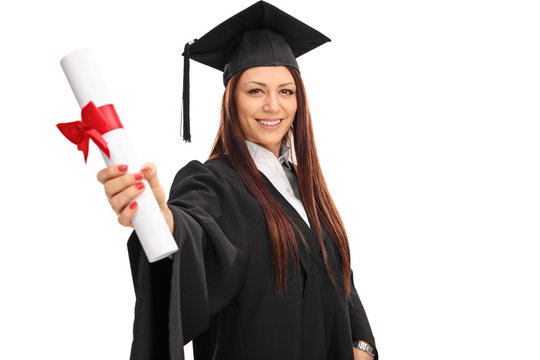 Woman in a graduation gown holding a diploma