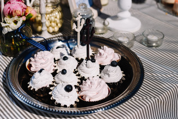 Candy bar. Table with sweet candy. Wedding cake, nautical style