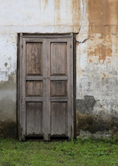 Old wall with door-building