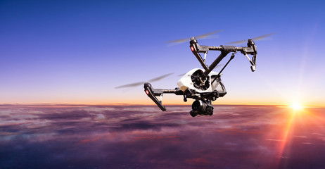 Drone for industrial works flying above clouds