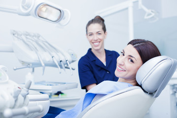 At the dentist. Female dentist in action.