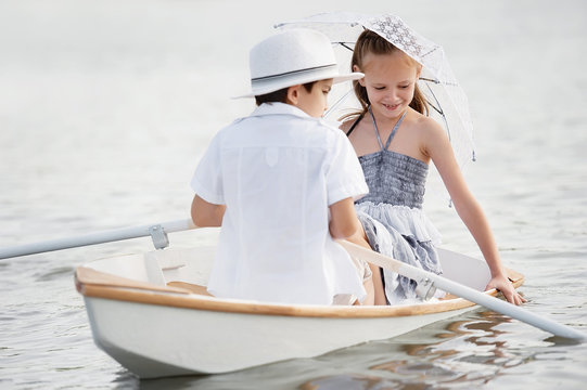 Boy with a girl riding on a boat