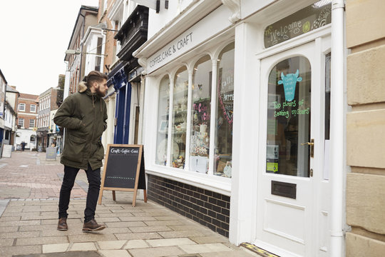 Man Walking To Coffee Shop