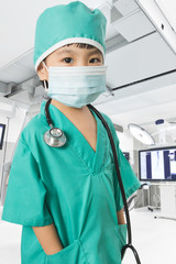 Asian Little Chinese Girl Playing a Doctor with Mask and Stethos