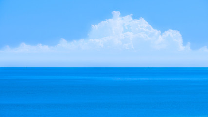 Fototapeta na wymiar Blue sea , blue sky and white clouds in Hua Hin , Thailand