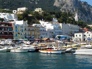 Obraz premium Boats Tied Up Alongside At Marina Grande Port - Italy, Capri / Port of Capri Island in Summer Day, Italy, Tyrrhenian Sea, Gulf of Naples