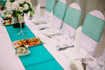 A festive table setting. Design in turquoise colour
