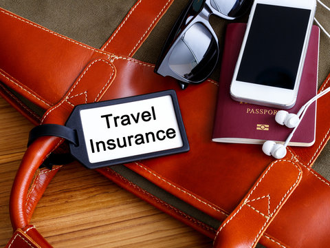 Travel insurance tag on travel bag