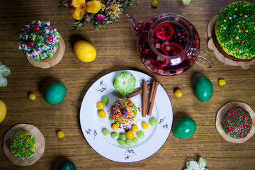 Easter celebrating family dinner, color eggs, cakes, fruit tea,  sweets
