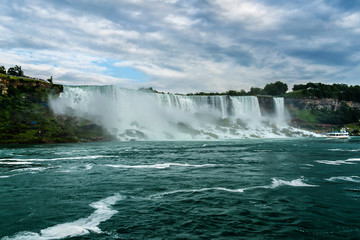 Niagara Falls closeup panorama at evening. Ontario, Canada.