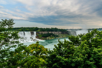 Niagara Falls closeup panorama at evening. Ontario, Canada.