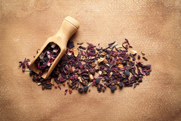 Dried tea leaves on paper background