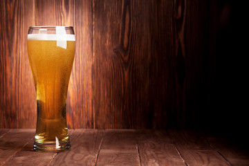 Lager beer glass on wooden table