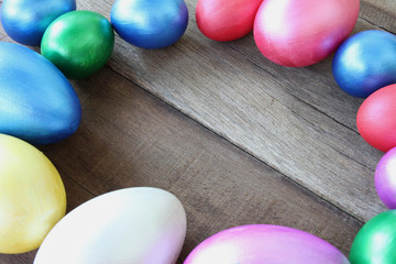 Obraz na płótnie Canvas easter eggs on wood background,Handmade painted for design happy