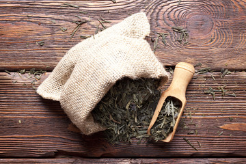 Fototapeta na wymiar Dried tea leaves in jute bag