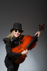 Fototapeta premium Young woman in musical concept