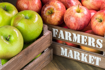 Assorted farm organic apples in crates.
