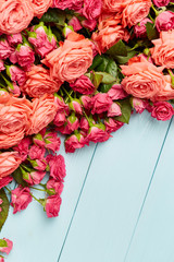 Roses on wooden background