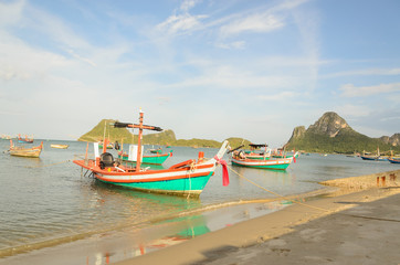 Naklejka na ściany i meble Small fishing boats in the beach