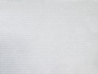 Texture of waved cardboard. Bright monochrome paper.