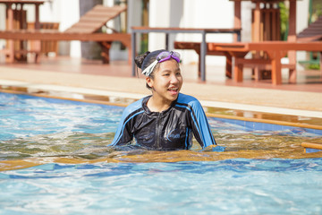 Asian girl in a swimming pool.